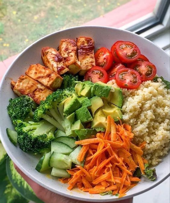 Colorful balanced plate with vegetables grains and protein